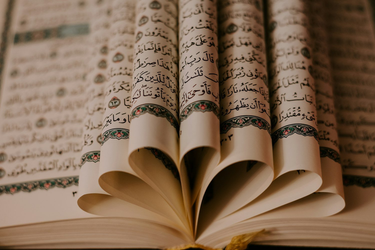 Mentor and new Muslim reading Quran together